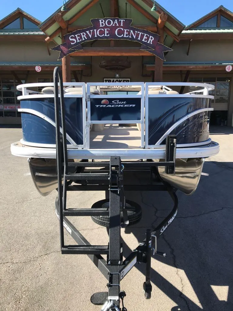 Slide: The Image of 2025 Sun Tracker Fishin' Barge 20 DLX at boat service center. - 3