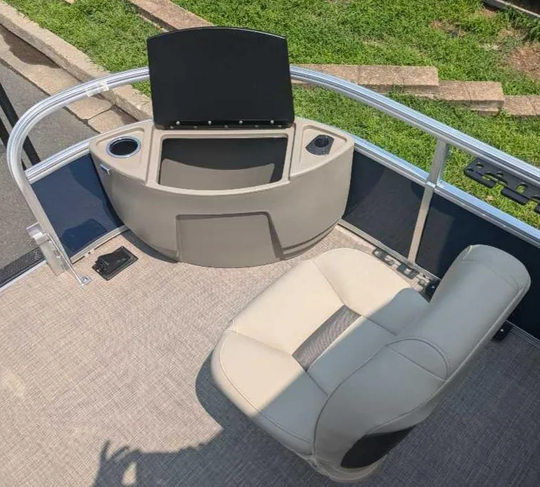 Slide: The Image of 2025 Sun Tracker Bass Buggy 18 DLX boat interior with seating and console. - 11