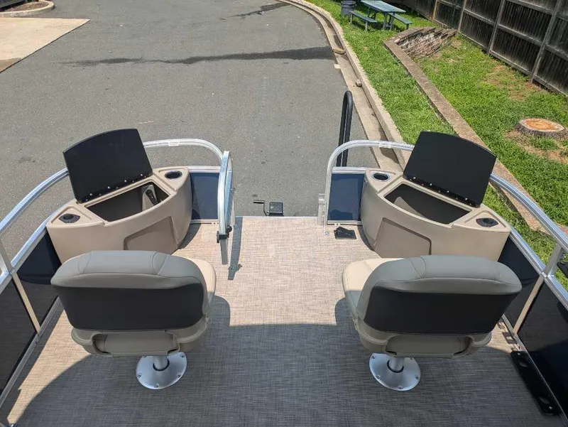 Slide: The Image of 2025 Sun Tracker Bass Buggy 18 DLX pontoon boat with dual swivel seats. - 5