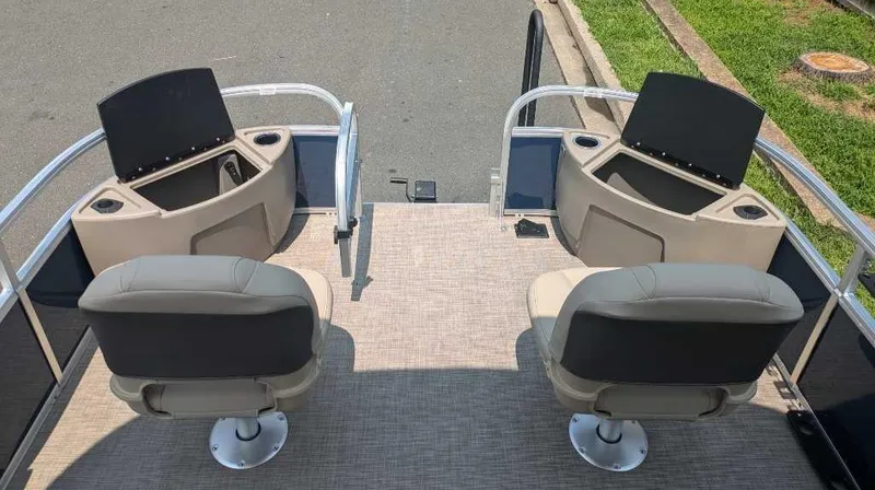Slide: The Image of 2025 Sun Tracker Bass Buggy 18 DLX pontoon boat interior with two swivel seats. - 8