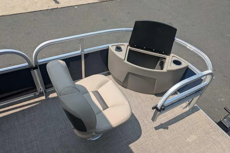Slide: The Image of 2025 Sun Tracker Bass Buggy 18 DLX boat interior with seating and console. - 9