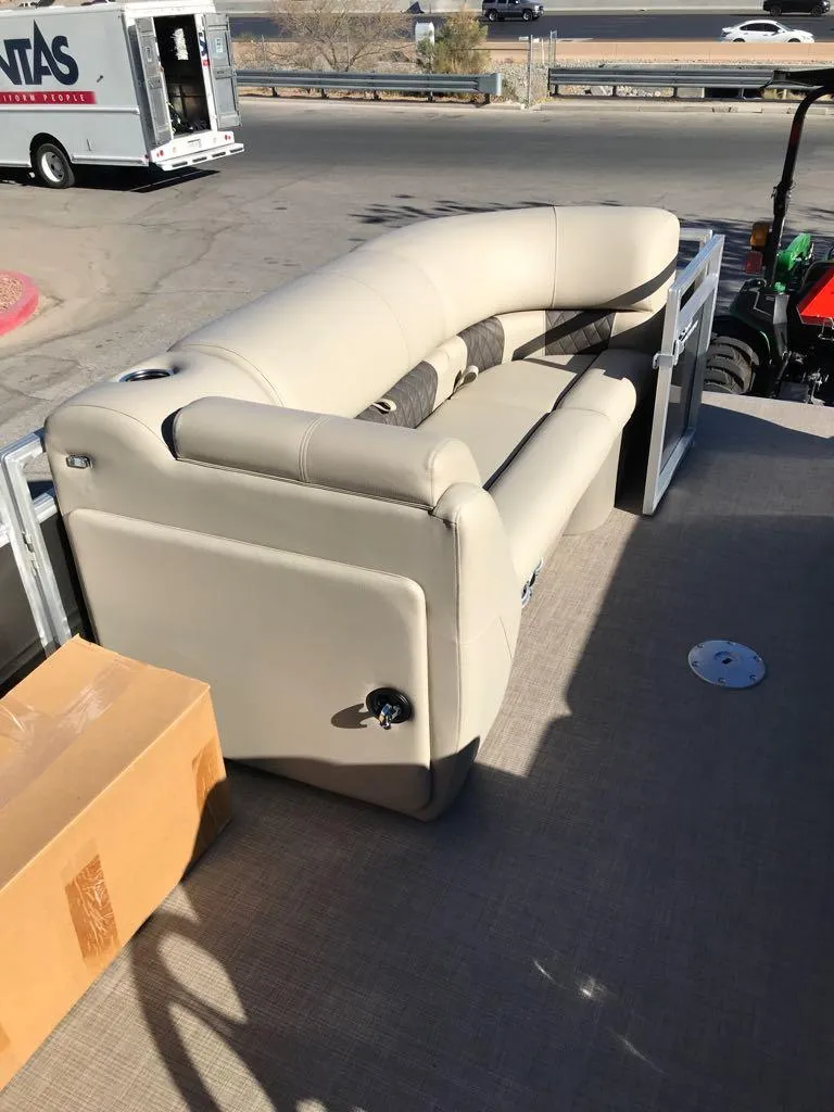 Slide: The Image of 2025 Sun Tracker Party Barge 22 DLX with beige seating on deck. - 10