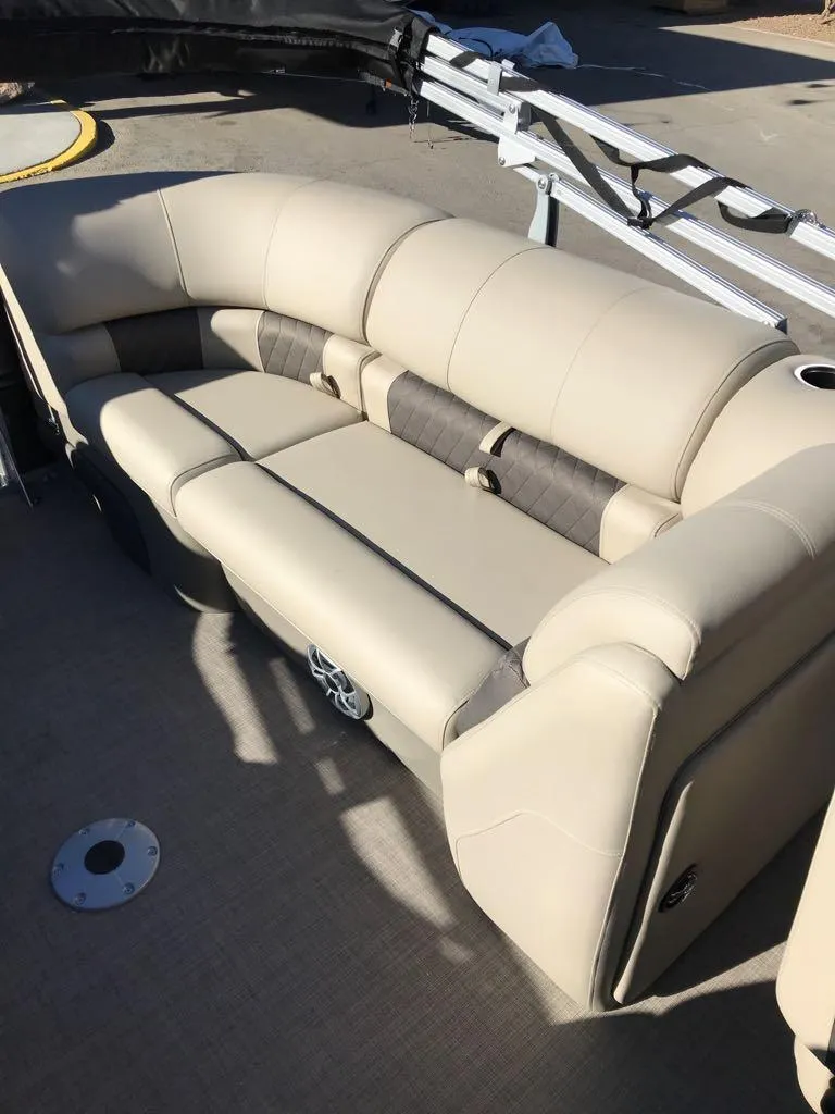 Slide: The Image of 2025 Sun Tracker Party Barge 22 DLX, beige seating, outdoor setting. - 11