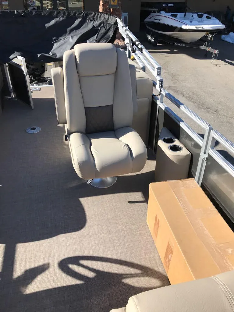 Slide: The Image of 2025 Sun Tracker Party Barge 22 DLX interior with seating and storage. - 9