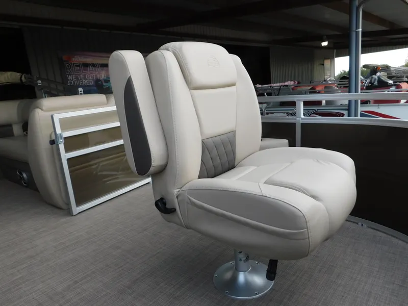 Slide: The Image of 2025 Sun Tracker SportFish 20 DLX boat seat, beige upholstery, under covered dock. - 12