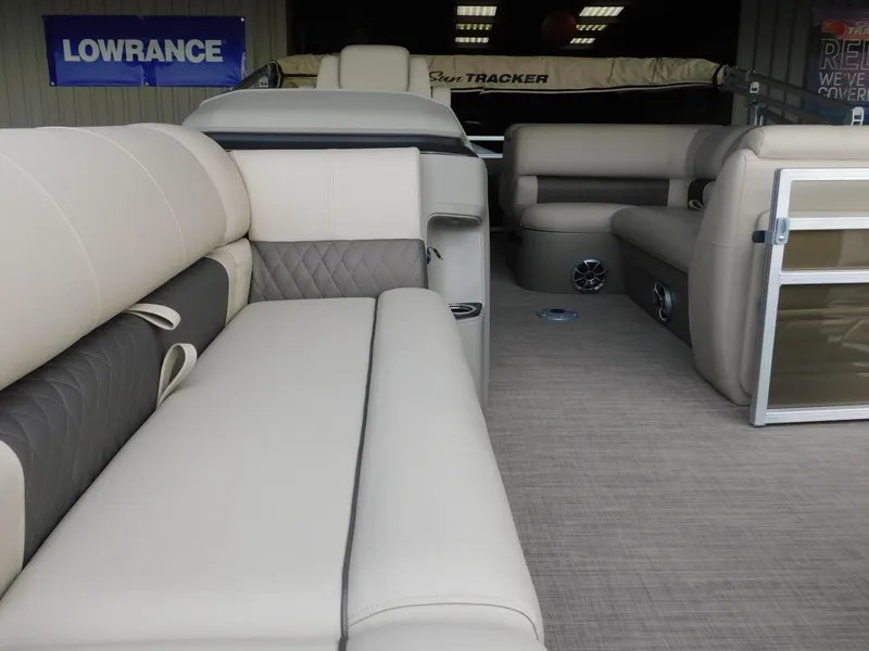 Slide: The Image of Interior of 2025 Sun Tracker SportFish 20 DLX pontoon boat with beige seating. - 16
