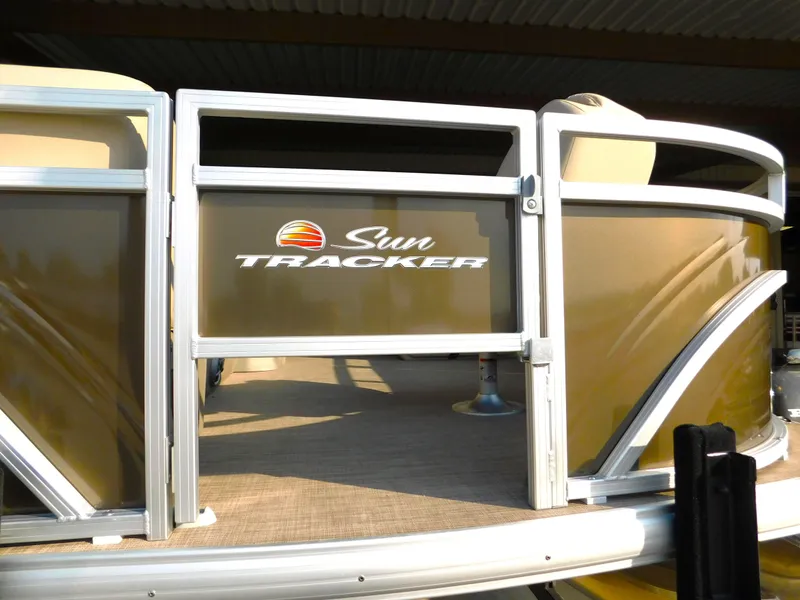 Slide: The Image of 2025 Sun Tracker SportFish 20 DLX pontoon boat, front view with logo. - 4