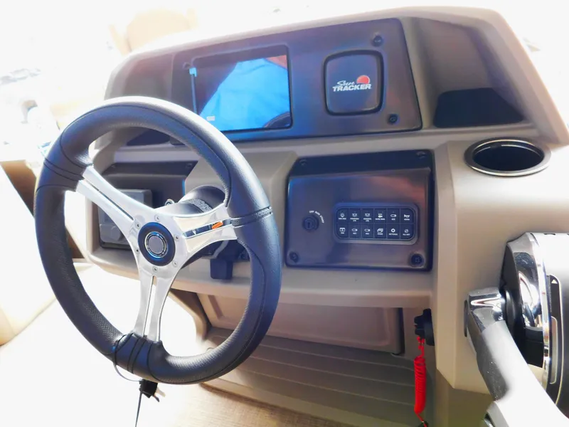Slide: The Image of Steering console of 2025 Sun Tracker SportFish 20 DLX boat with control panel. - 8