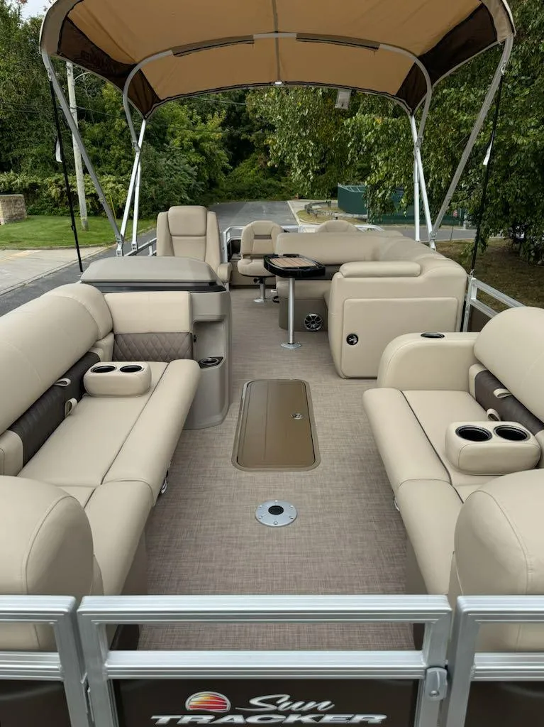 Slide: The Image of 2025 Sun Tracker SportFish 22 XP3 pontoon boat with spacious seating and canopy. - 6