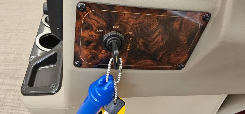 Slide: The Image of Key ignition panel of 2025 Sun Tracker Bass Buggy 18 DLX boat. - 10