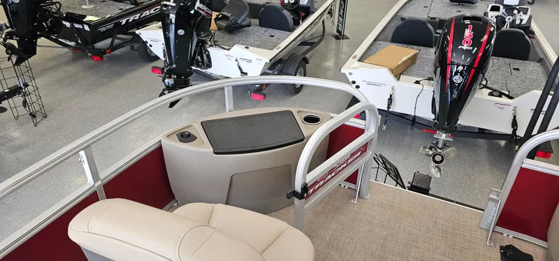 Slide: The Image of 2025 Sun Tracker Bass Buggy 18 DLX interior with seating and motor view. - 3