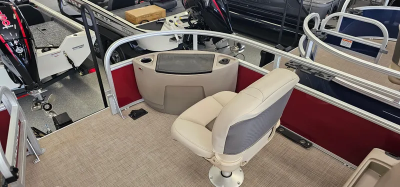 Slide: The Image of 2025 Sun Tracker Bass Buggy 18 DLX pontoon boat interior with seating and control panel. - 5