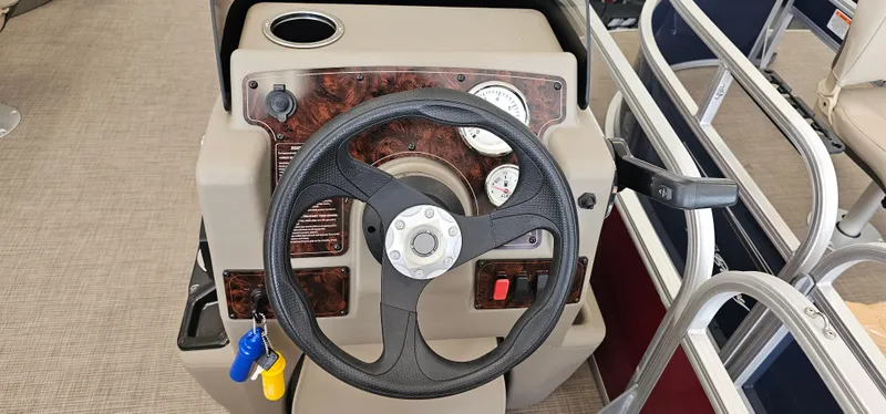 Slide: The Image of Steering console of 2025 Sun Tracker Bass Buggy 18 DLX pontoon boat. - 9