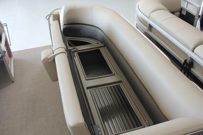 Slide: The Image of 2025 Sun Tracker Party Barge 18 DLX interior seating with storage compartments. - 3