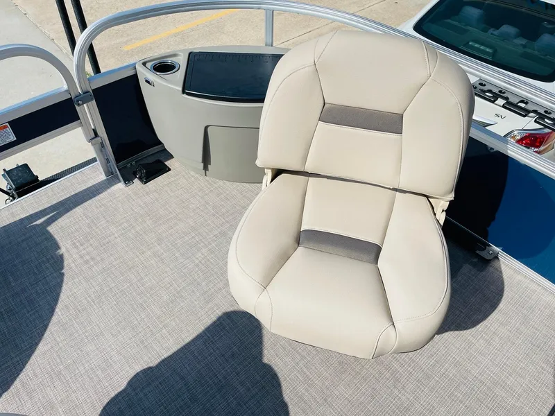 Slide: The Image of 2025 Sun Tracker Bass Buggy 18 DLX boat seat with beige upholstery and cup holder. - 12