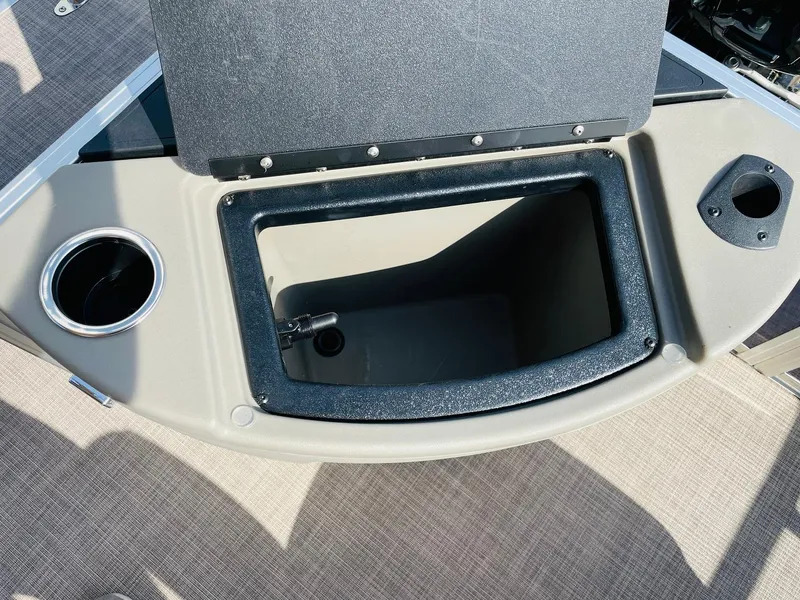 Slide: The Image of 2025 Sun Tracker Bass Buggy 18 DLX storage compartment with cup holder. - 27