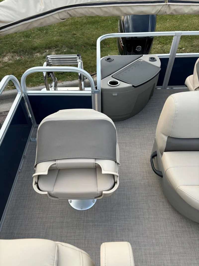 Slide: The Image of 2025 Sun Tracker Bass Buggy 18 DLX interior with seating and storage. - 11