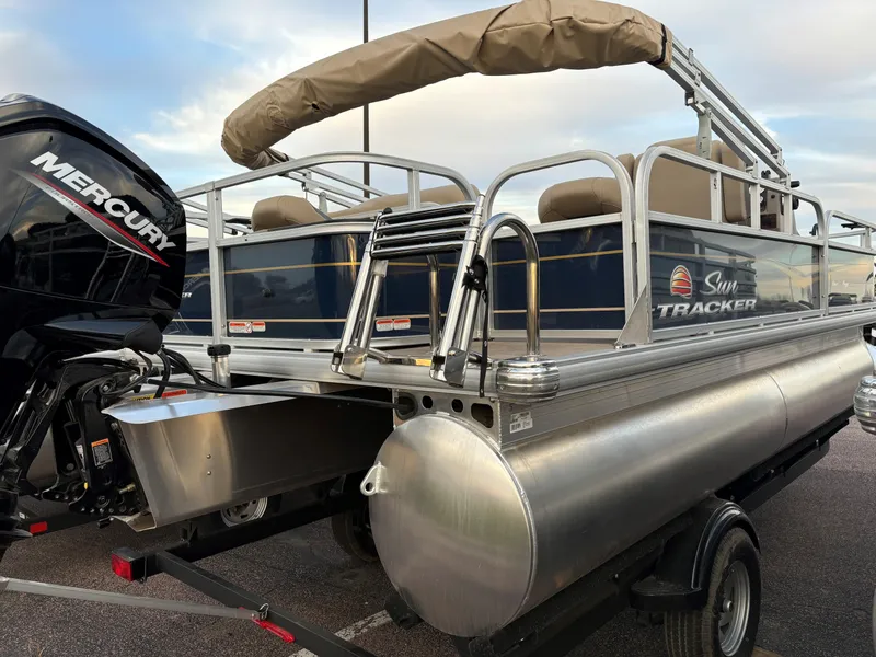 Slide: The Image of 2025 Sun Tracker Bass Buggy 18 DLX pontoon boat with Mercury engine. - 4