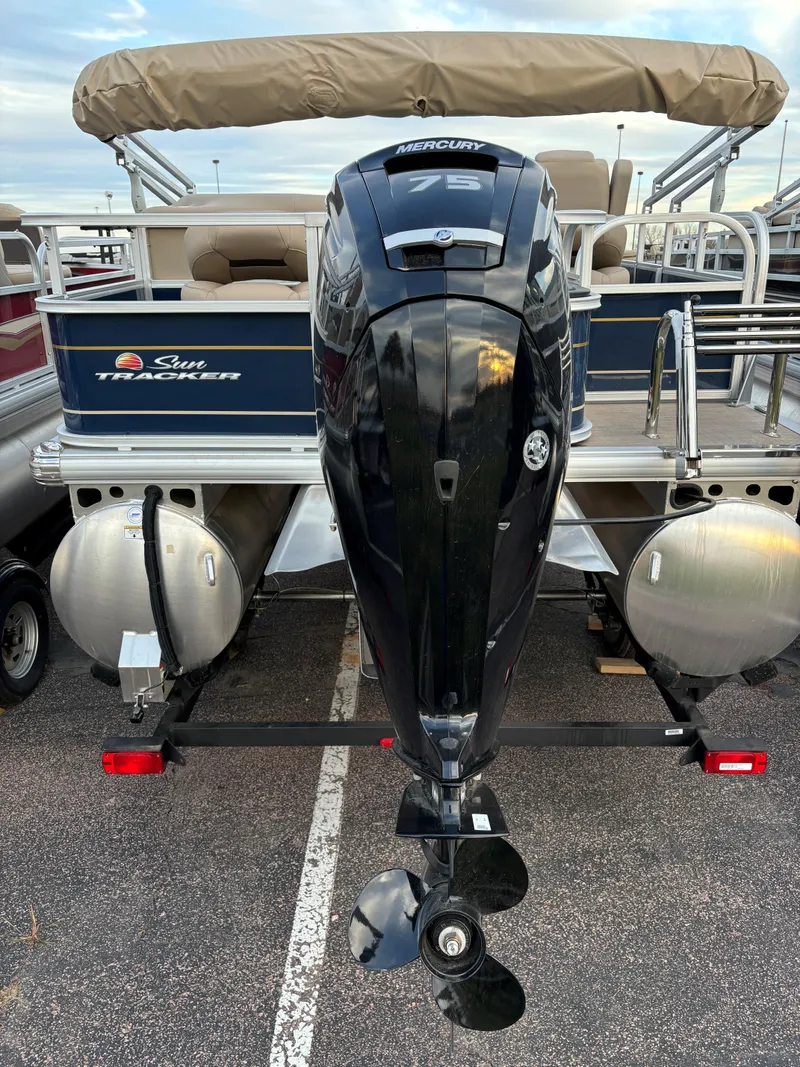 Slide: The Image of 2025 Sun Tracker Bass Buggy 18 DLX pontoon boat with powerful outboard motor. - 5