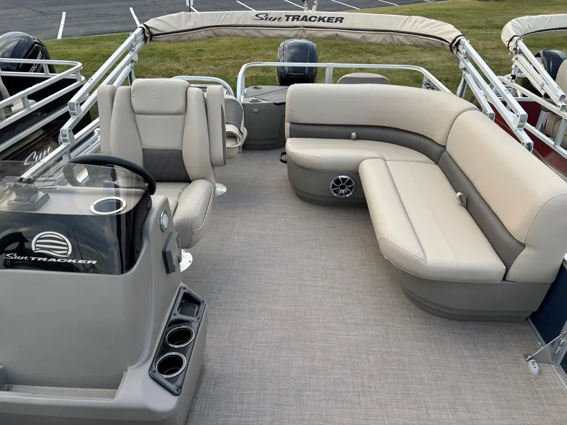 Slide: The Image of 2025 Sun Tracker Bass Buggy 18 DLX pontoon boat with spacious seating and modern design. - 7