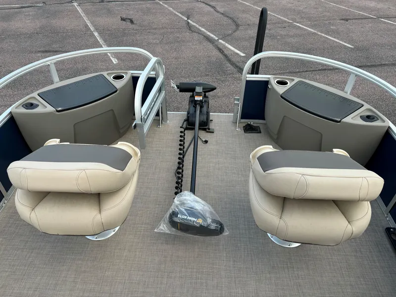 Slide: The Image of 2025 Sun Tracker Bass Buggy 18 DLX pontoon boat interior with seating and controls. - 8