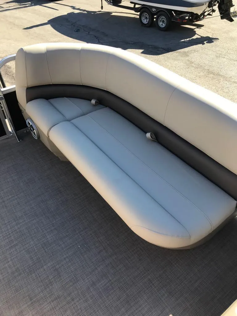 Slide: The Image of 2025 Sun Tracker Party Barge 16 DLX seating area with beige upholstery. - 6