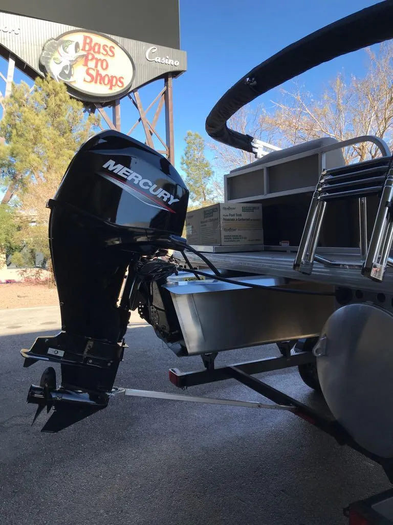 Slide: The Image of 2025 Sun Tracker Party Barge 16 DLX with Mercury outboard motor near Bass Pro Shops. - 9