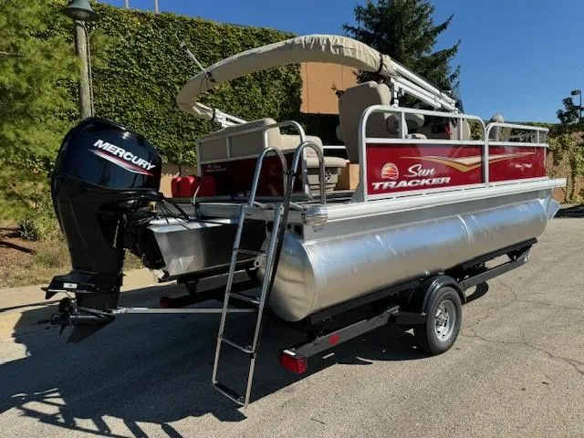 Slide: The Image of 2025 Sun Tracker Bass Buggy 16 XL Select pontoon boat with Mercury engine. - 5