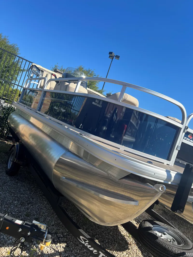 Slide: The Image of 2025 Sun Tracker Bass Buggy 16 XL Select pontoon boat on display. - 3