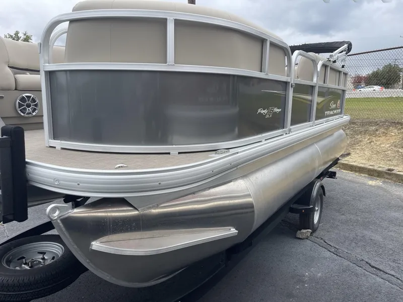 Slide: The Image of 2025 Sun Tracker Party Barge 16 DLX pontoon boat on trailer. - 3