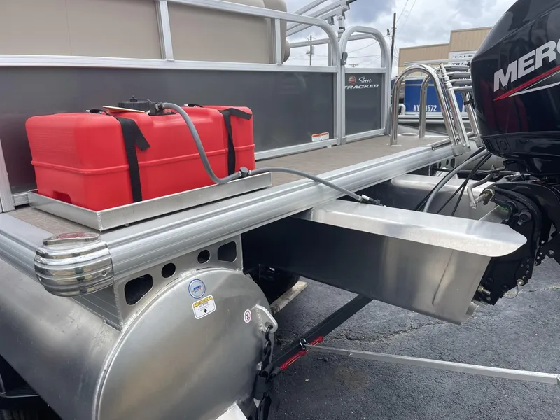 Slide: The Image of 2025 Sun Tracker Party Barge 16 DLX with red fuel tank and Mercury outboard motor. - 5