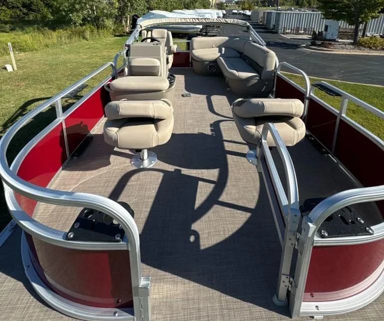 Slide: The Image of 2025 Sun Tracker Bass Buggy 16 XL Select pontoon boat with spacious seating and red exterior. - 6