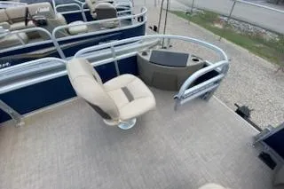 Slide: The Image of 2025 Sun Tracker Bass Buggy 18 DLX pontoon boat with beige seating and spacious deck. - 16
