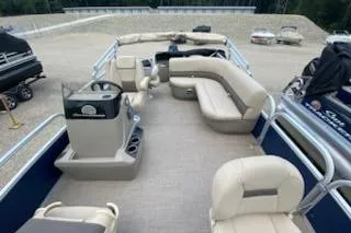 Slide: The Image of 2025 Sun Tracker Bass Buggy 18 DLX pontoon boat with spacious seating and modern design. - 21