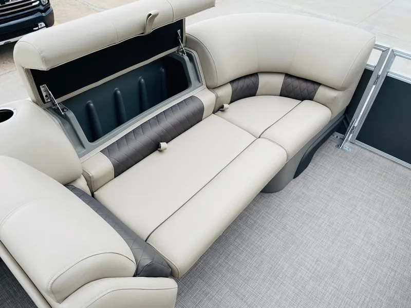 Slide: The Image of 2025 Sun Tracker Party Barge 20 DLX interior seating with storage compartment. - 10