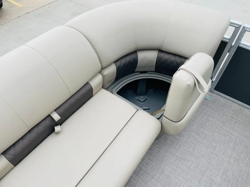 Slide: The Image of 2025 Sun Tracker Party Barge 20 DLX interior seating with storage compartment. - 12