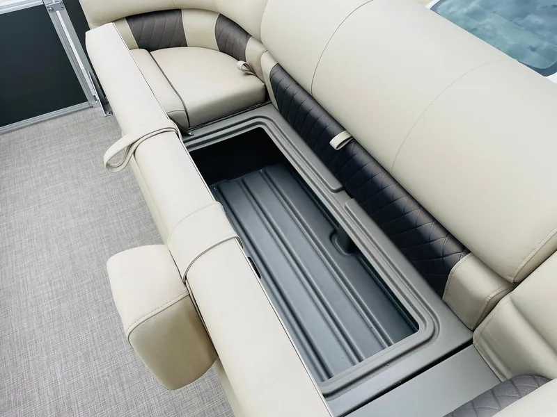 Slide: The Image of Sun Tracker Party Barge 20 DLX 2025 interior seating with storage compartment. - 16