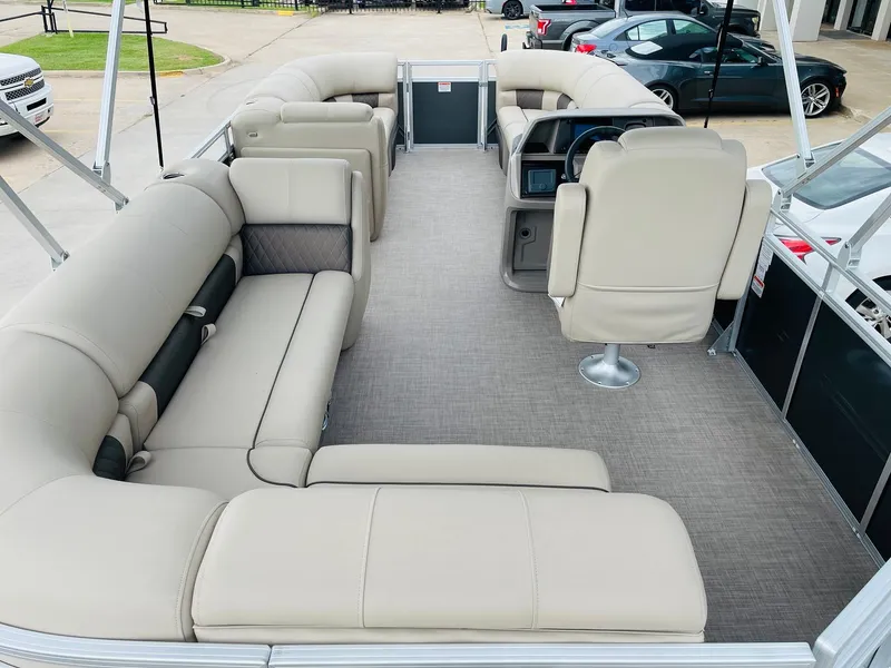 Slide: The Image of 2025 Sun Tracker Party Barge 20 DLX with spacious seating and modern interior design. - 7