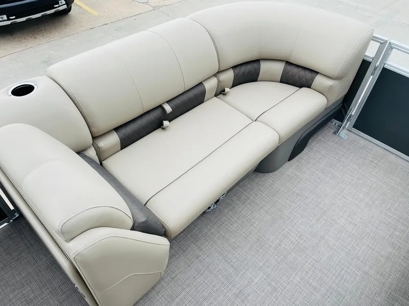 Slide: The Image of 2025 Sun Tracker Party Barge 20 DLX pontoon boat seating, beige and brown upholstery. - 9