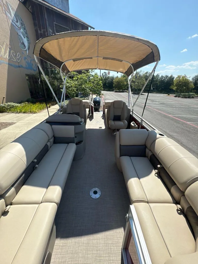Slide: The Image of 2025 Sun Tracker Party Barge 22 DLX with spacious seating and canopy. - 5