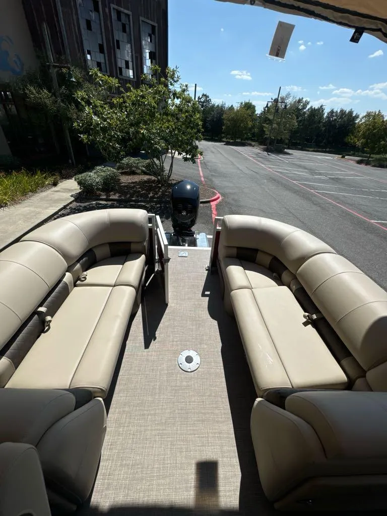 Slide: The Image of 2025 Sun Tracker Party Barge 22 DLX with spacious seating and outdoor view. - 6