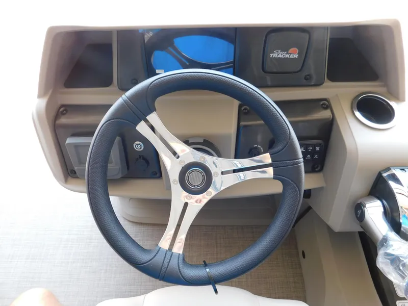 Slide: The Image of Steering wheel of 2025 Sun Tracker Fishin' Barge 22 DLX boat, dashboard view. - 11