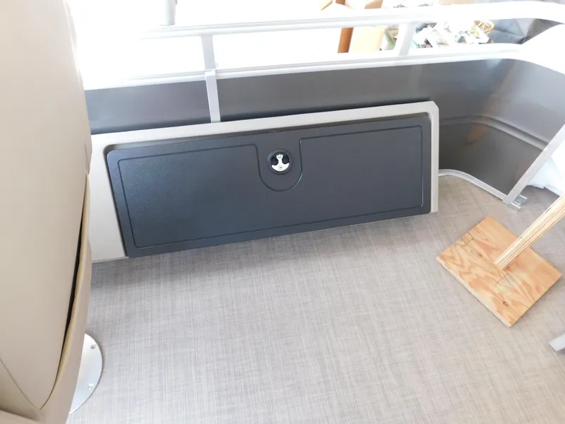 Slide: The Image of Interior of 2025 Sun Tracker Fishin' Barge 22 DLX with storage compartment. - 15