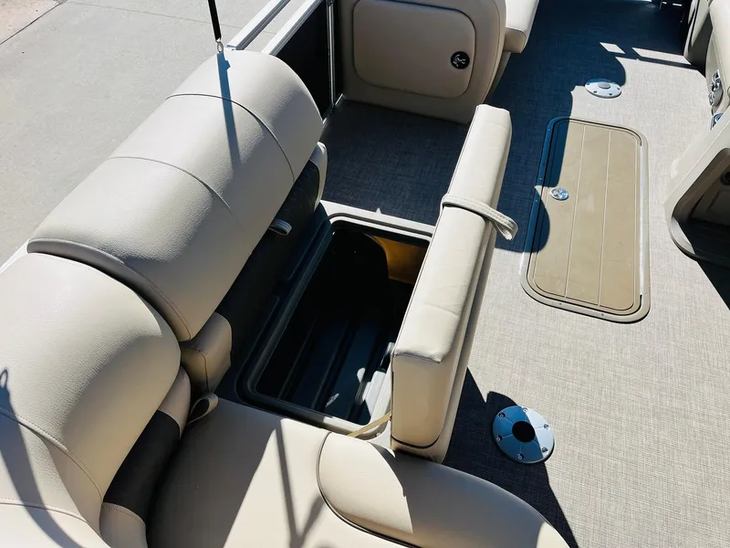 Slide: The Image of 2025 Sun Tracker Party Barge 22 RF XP3 interior with open storage compartment. - 27