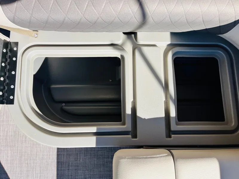Slide: The Image of 2025 Sun Tracker Party Barge 22 RF XP3 storage compartments with cushioned seating. - 29