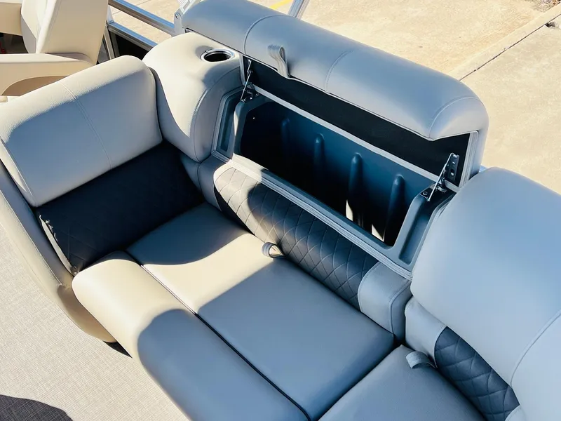 Slide: The Image of 2025 Sun Tracker Party Barge 22 RF XP3 seating with storage compartment open. - 38