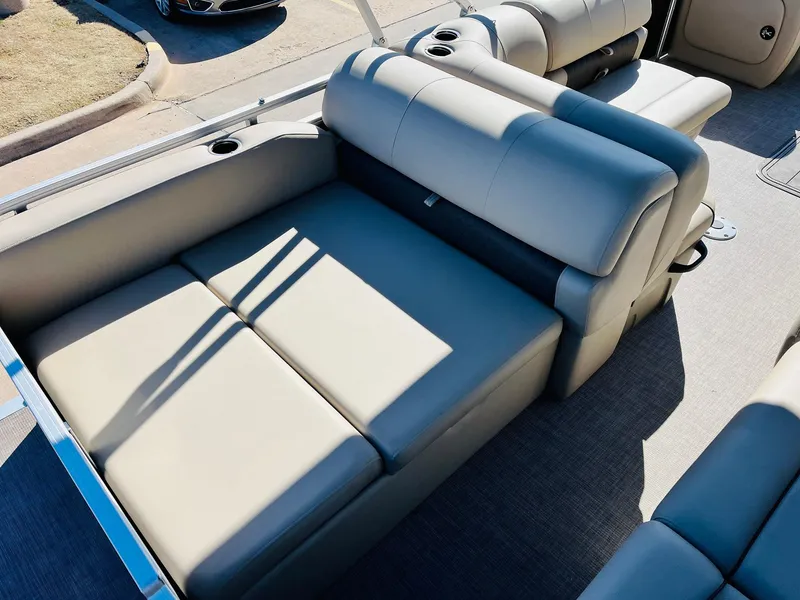 Slide: The Image of 2025 Sun Tracker Party Barge 22 RF XP3 interior seating, beige upholstery, spacious layout. - 42