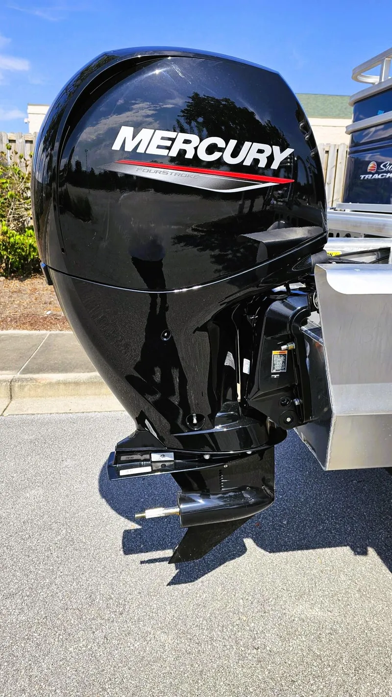 Slide: The Image of 2025 Sun Tracker Fishin' Barge 22 XP3 with Mercury outboard motor. - 4