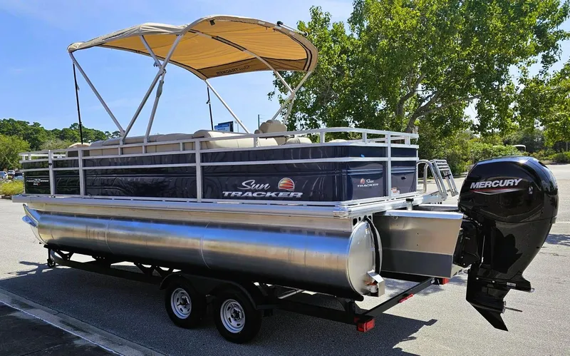 Slide: The Image of 2025 Sun Tracker Fishin' Barge 22 XP3 pontoon boat with Mercury engine on trailer. - 8