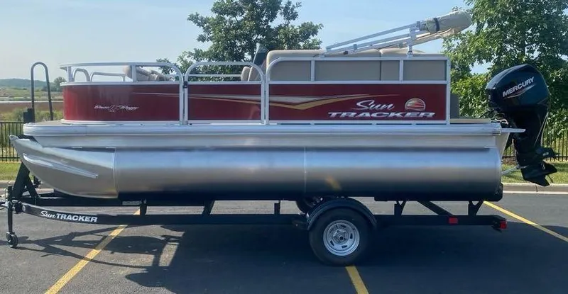 Slide: The Image of 2025 Sun Tracker Bass Buggy 16 XL Select pontoon boat on trailer. - 75